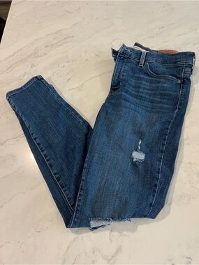 Levi’s 311 Dark Blue Distressed Skinny Jeans